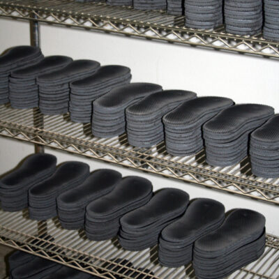 Production run laser cut rubber sandals
