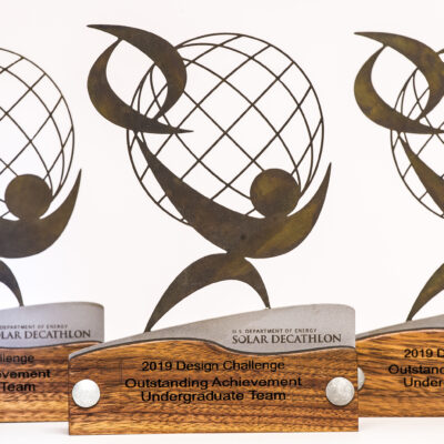 Custom Artist Award group - granite, laser cut steel, laser burned, laser etched and patina.